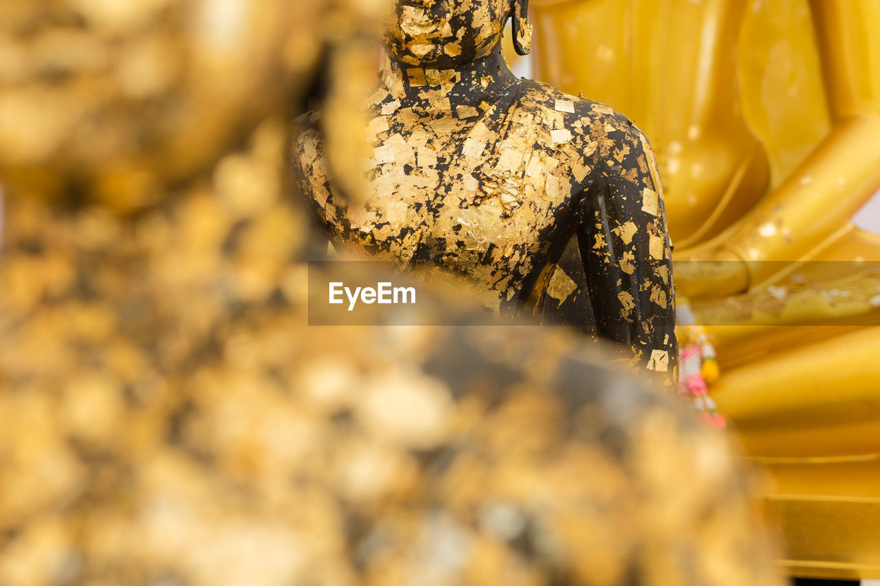 Close-up of old buddha statues