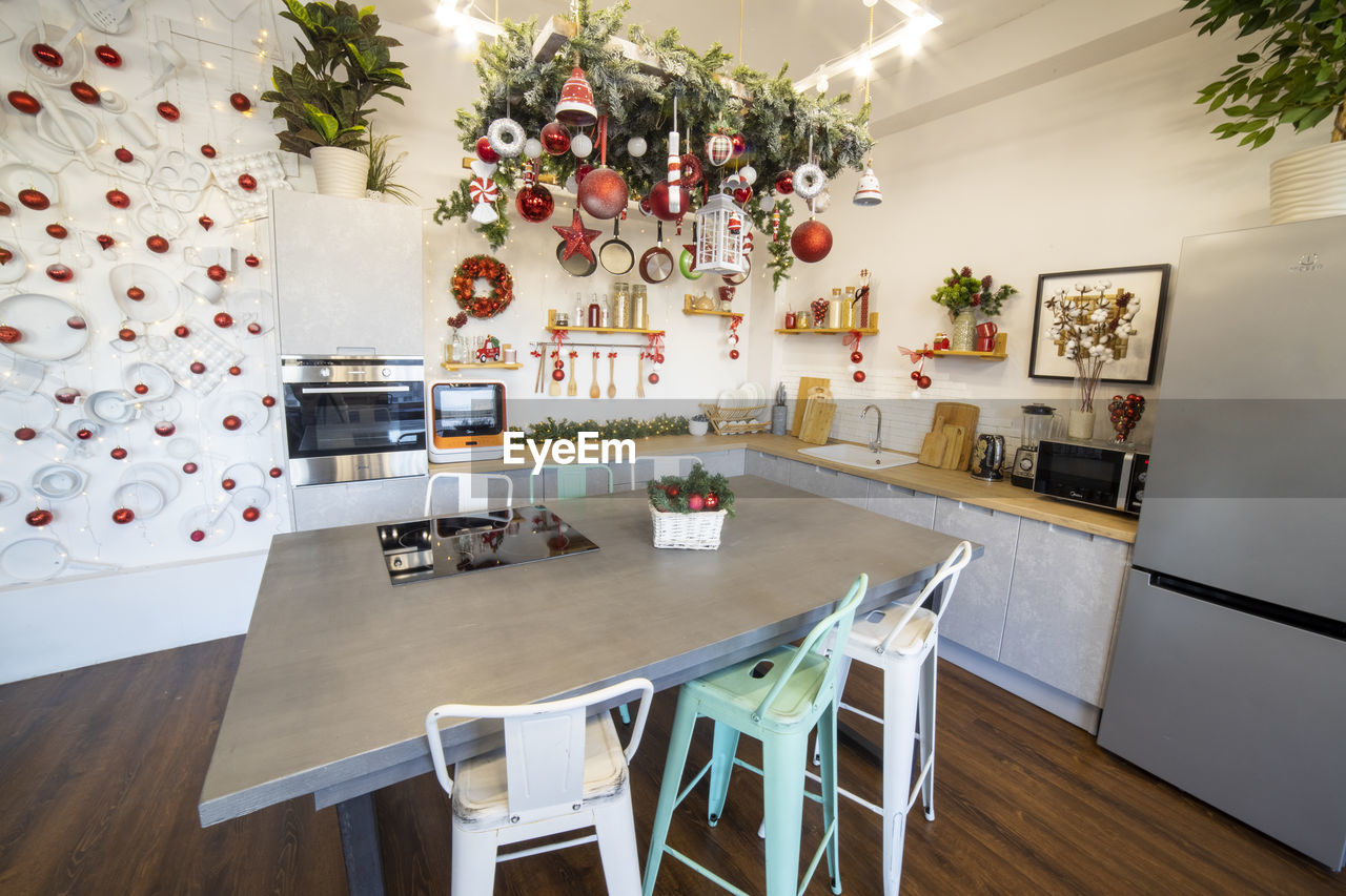 Close-up of a cozy modern kitchen for a large family, decorated for the new year celebration