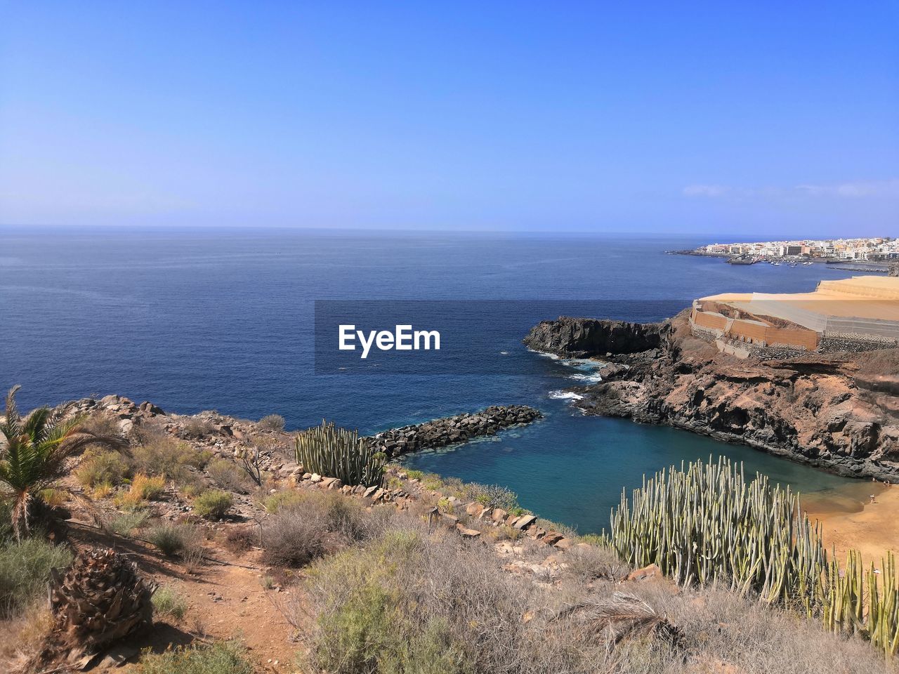 Scenic view of sea against clear blue sky