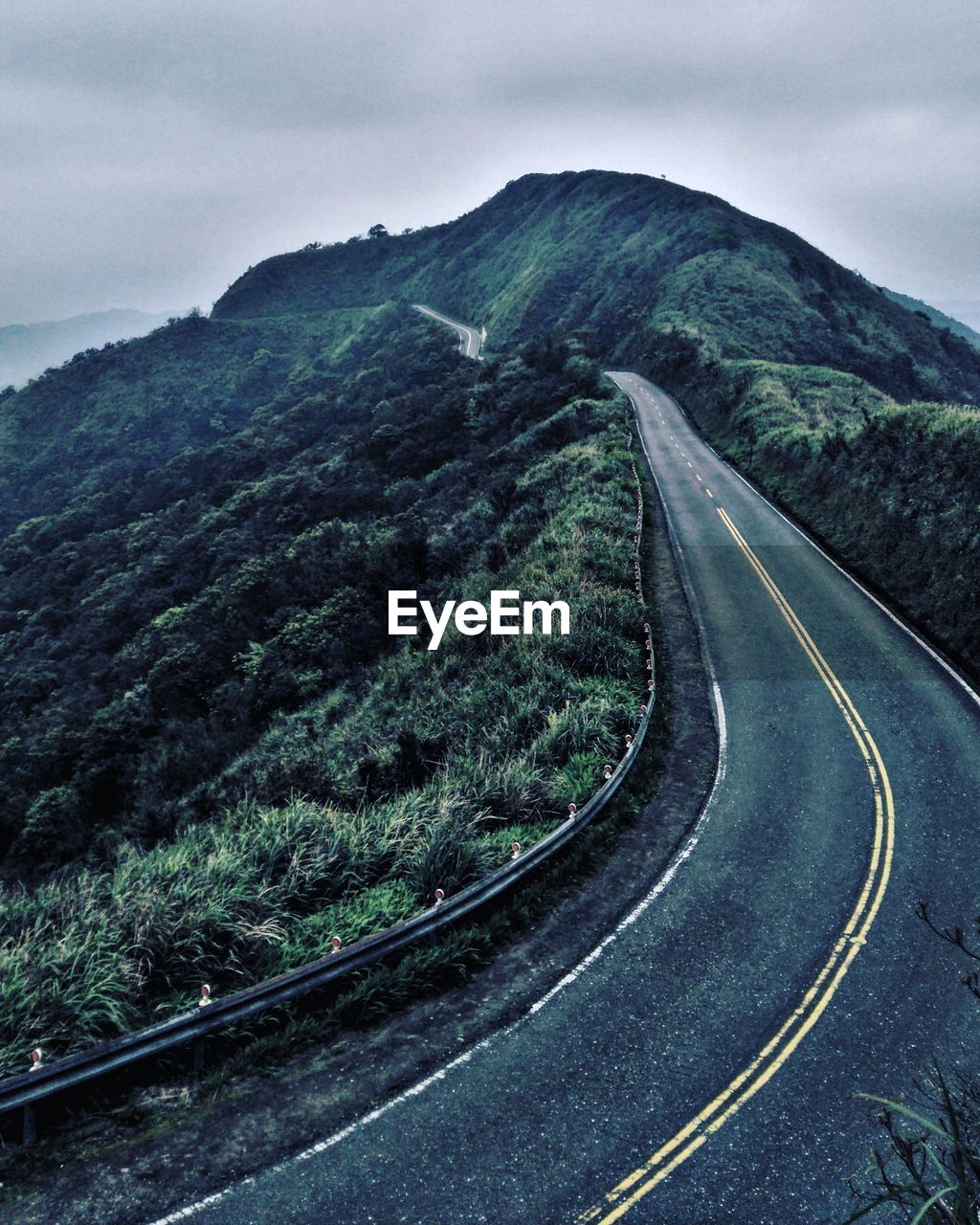 Scenic view of mountain road against sky