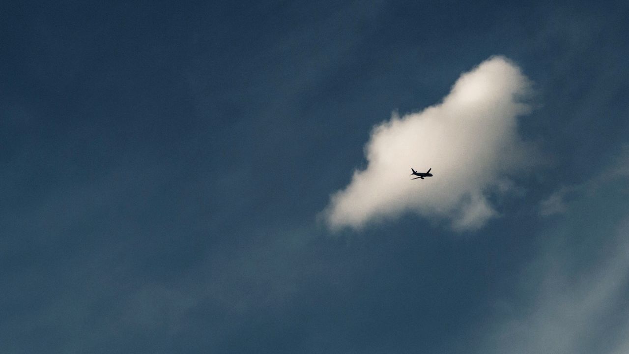 LOW ANGLE VIEW OF AIRSHOW AGAINST SKY