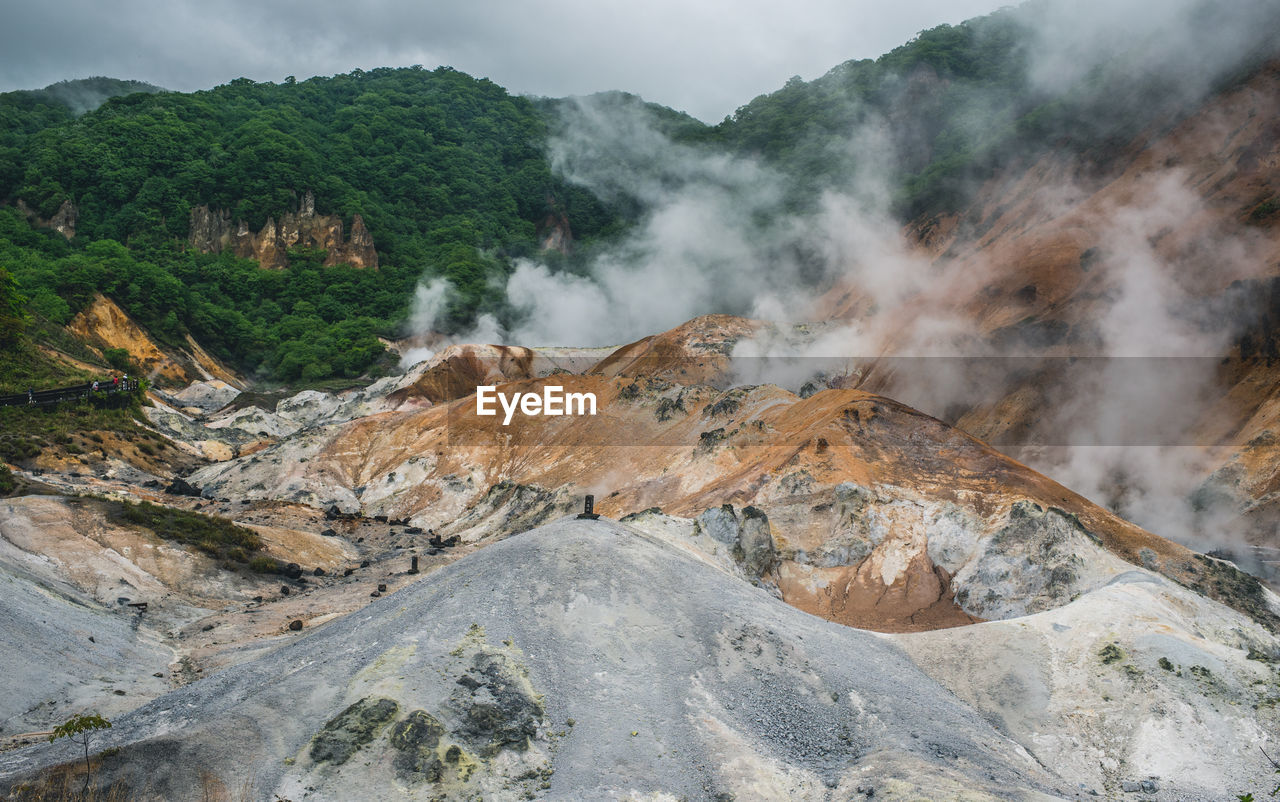 Smoke emitting from volcanic mountain