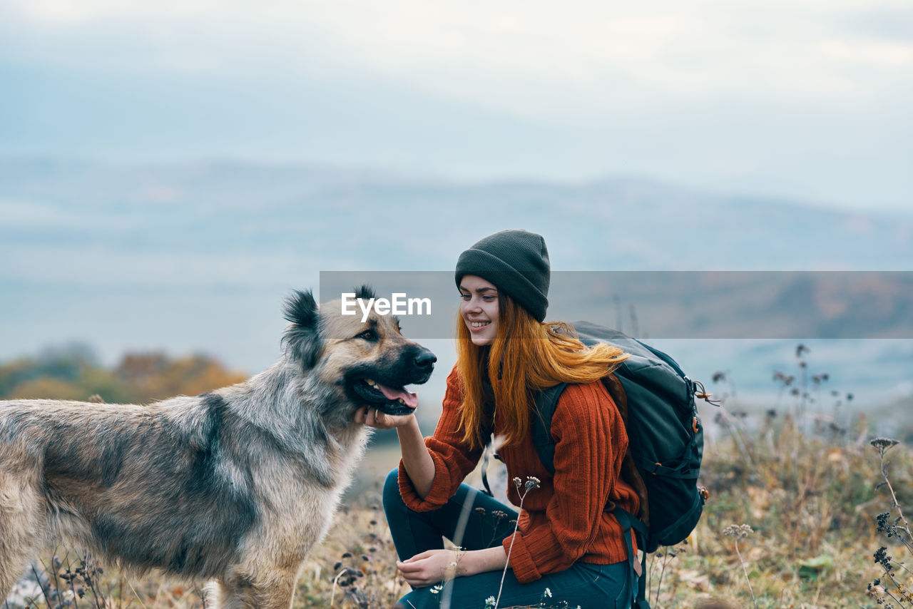 YOUNG WOMAN WITH DOG