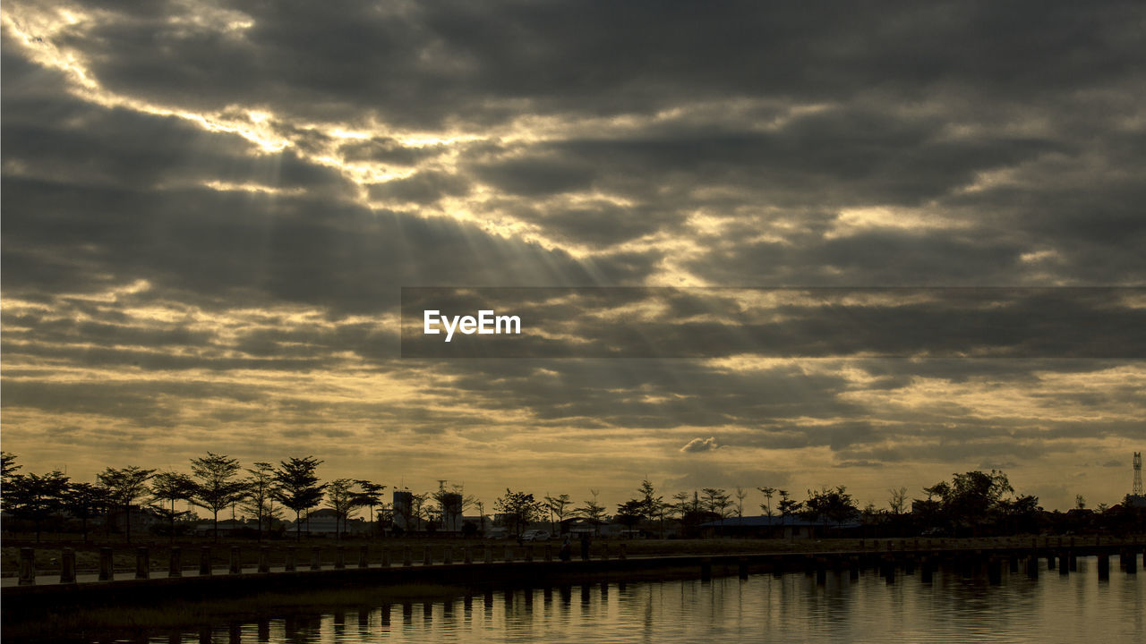 Scenic view of silhouette trees against sky during sunset