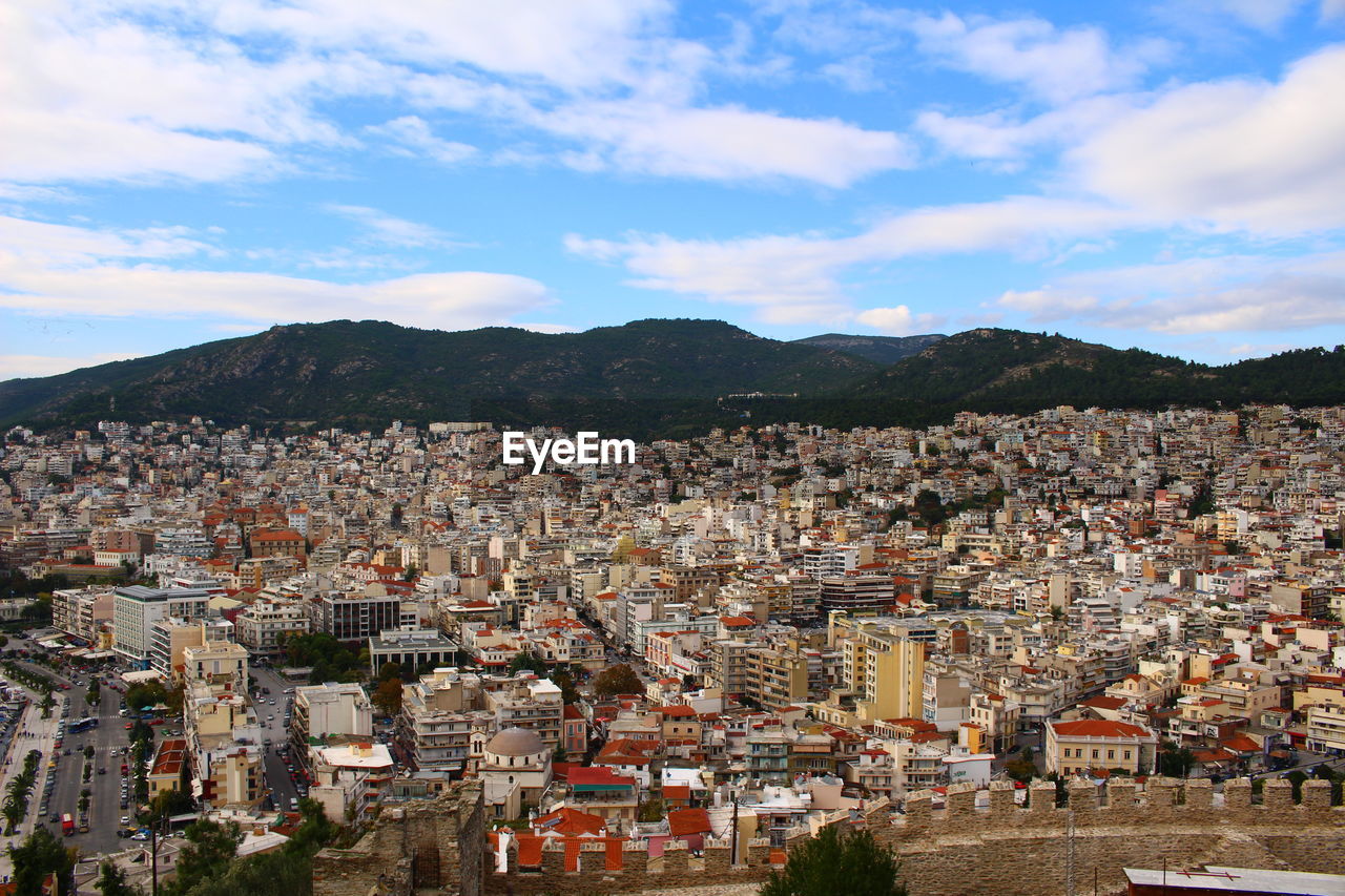 Aerial view of townscape against sky