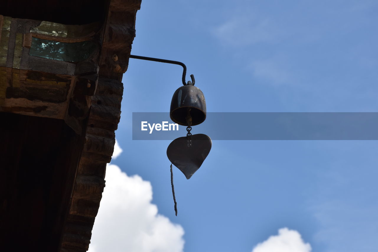 LOW ANGLE VIEW OF ELECTRIC LAMP AGAINST BLUE SKY