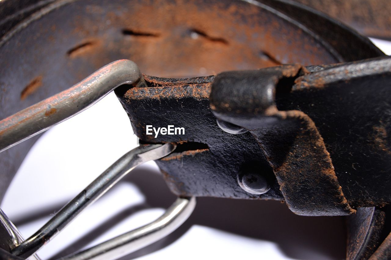 Worn out discarded belt from man's pants