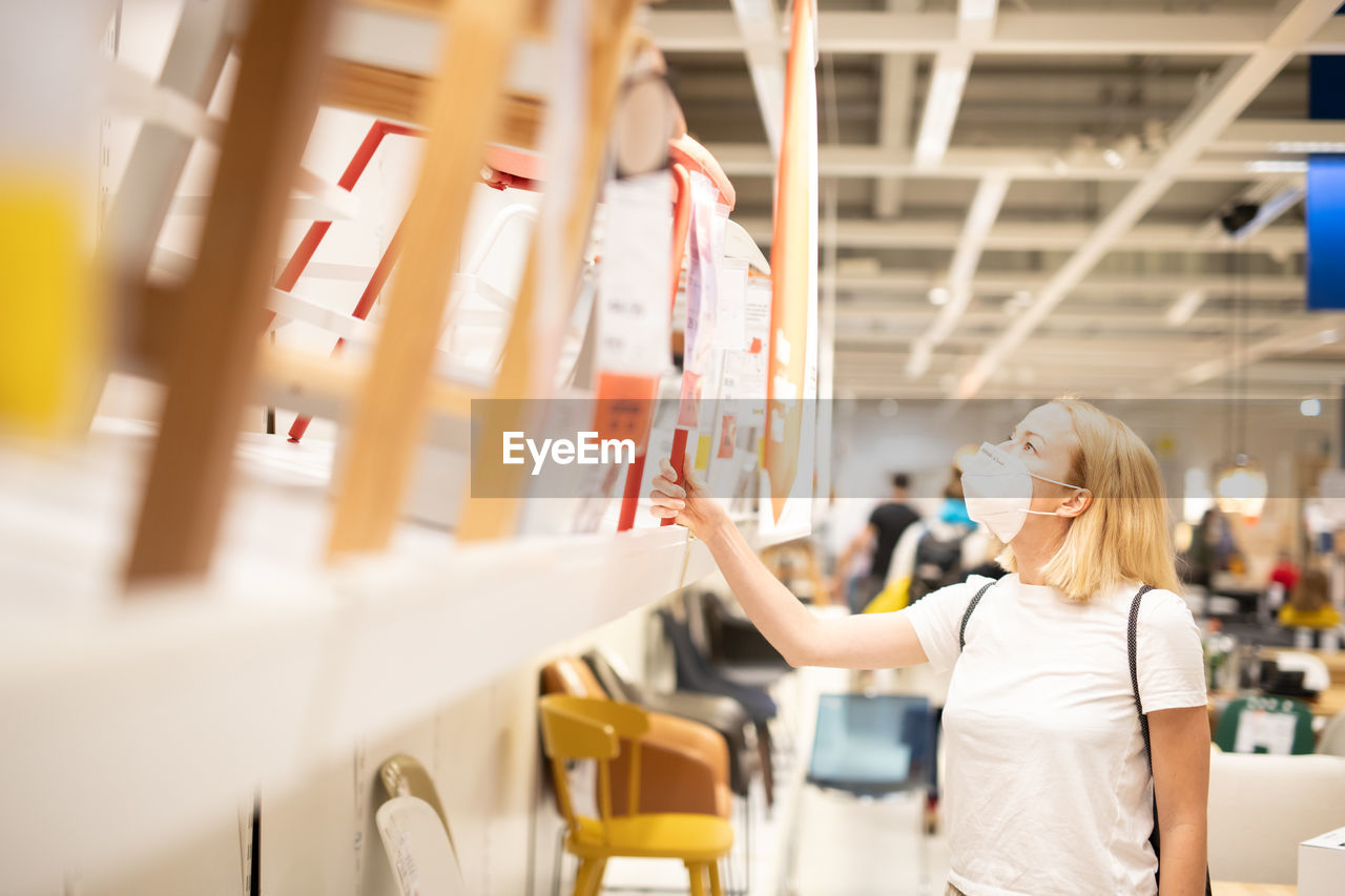 Woman working in shopping mall