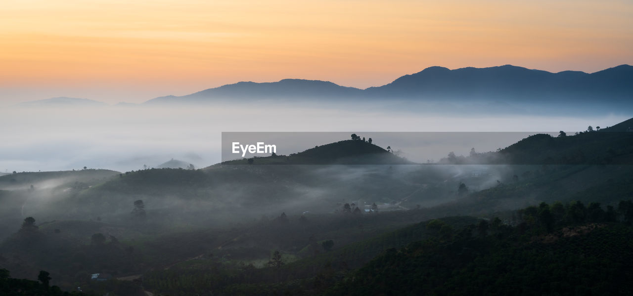 Scenic view of mountains against sky during sunset