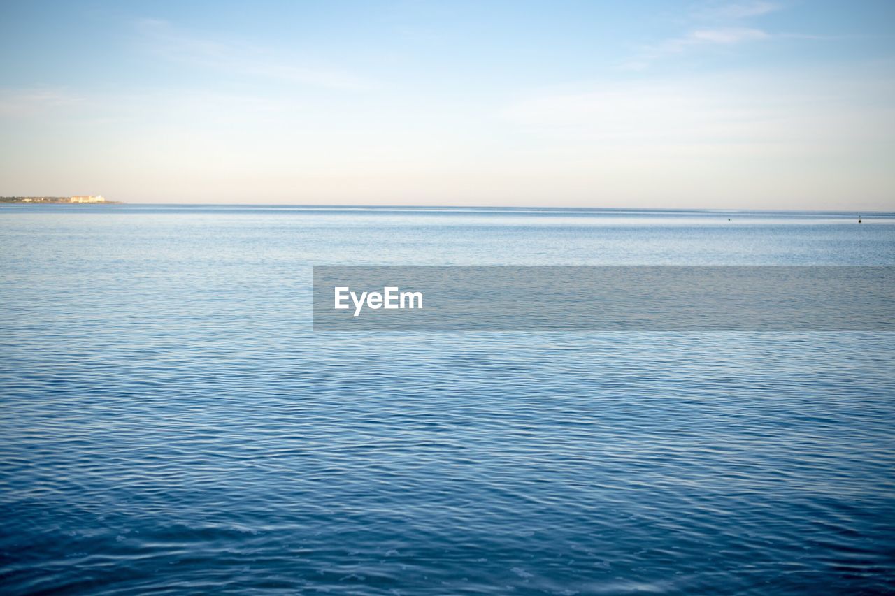 SCENIC VIEW OF BLUE SEA AGAINST CLEAR SKY