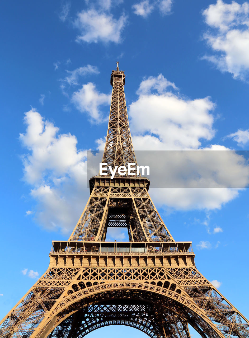 Fantastic eiffel tower with blue sky and white clouds in vertical