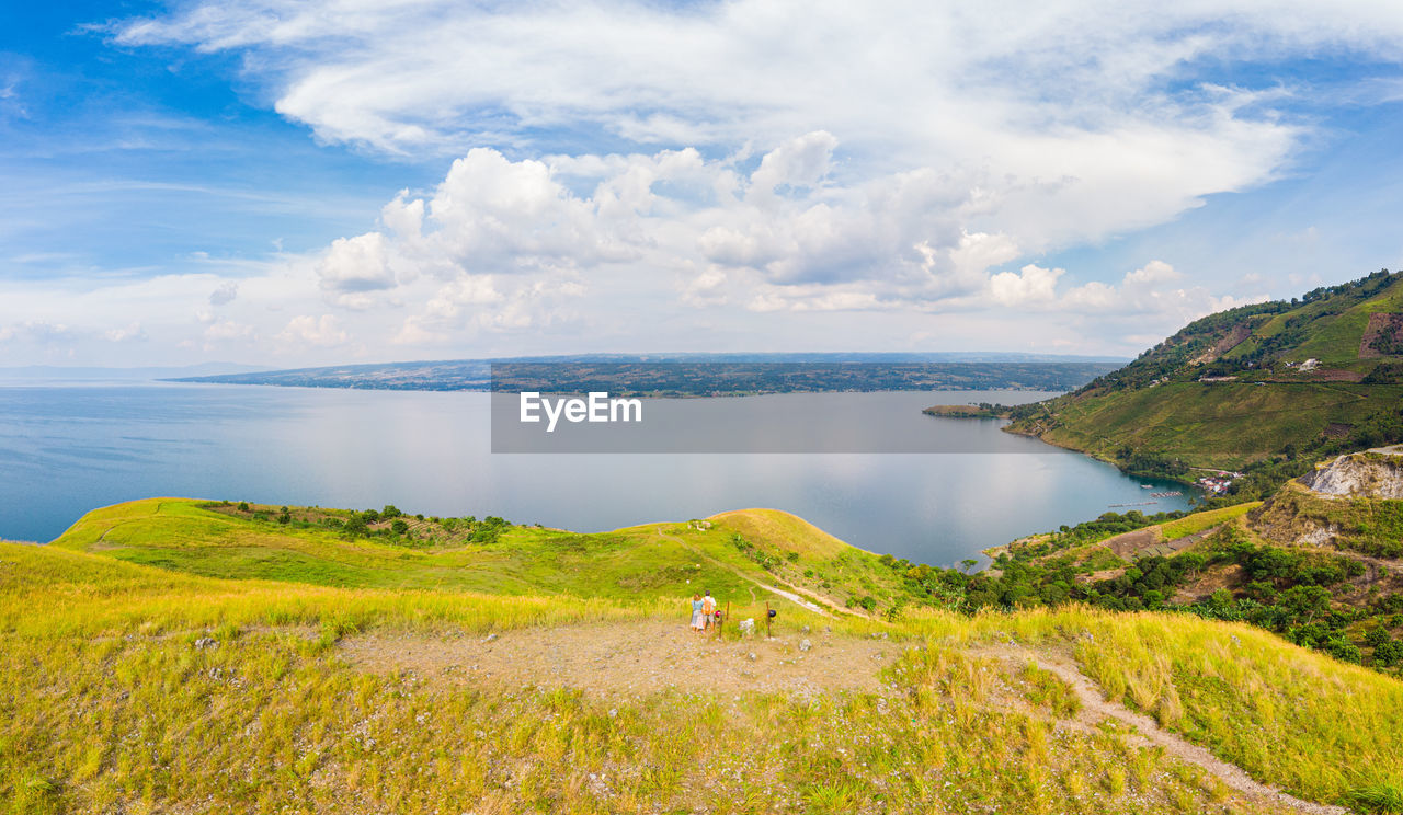 SCENIC VIEW OF SEA AND SHORE AGAINST SKY