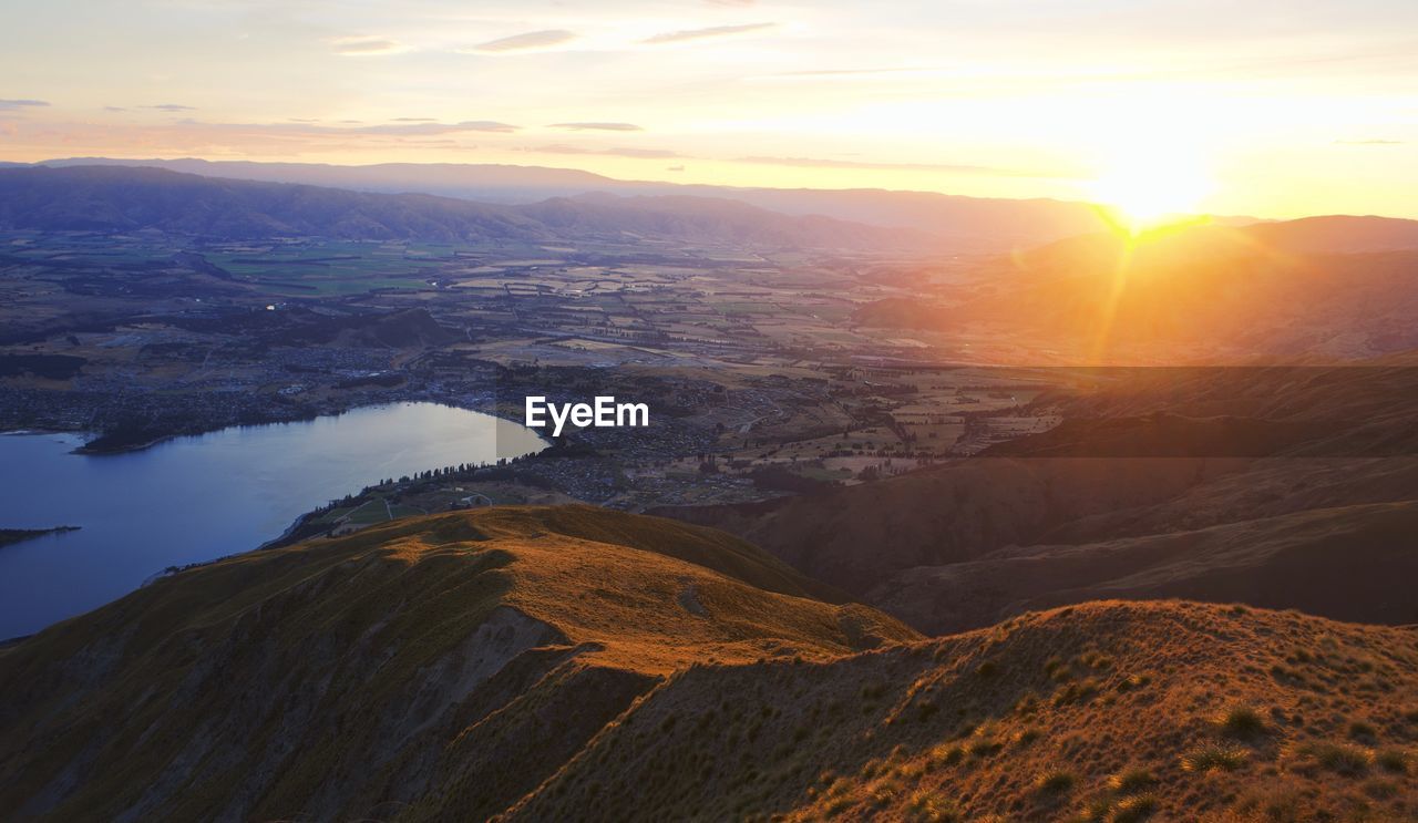 Scenic view of mountains against sky during sunset