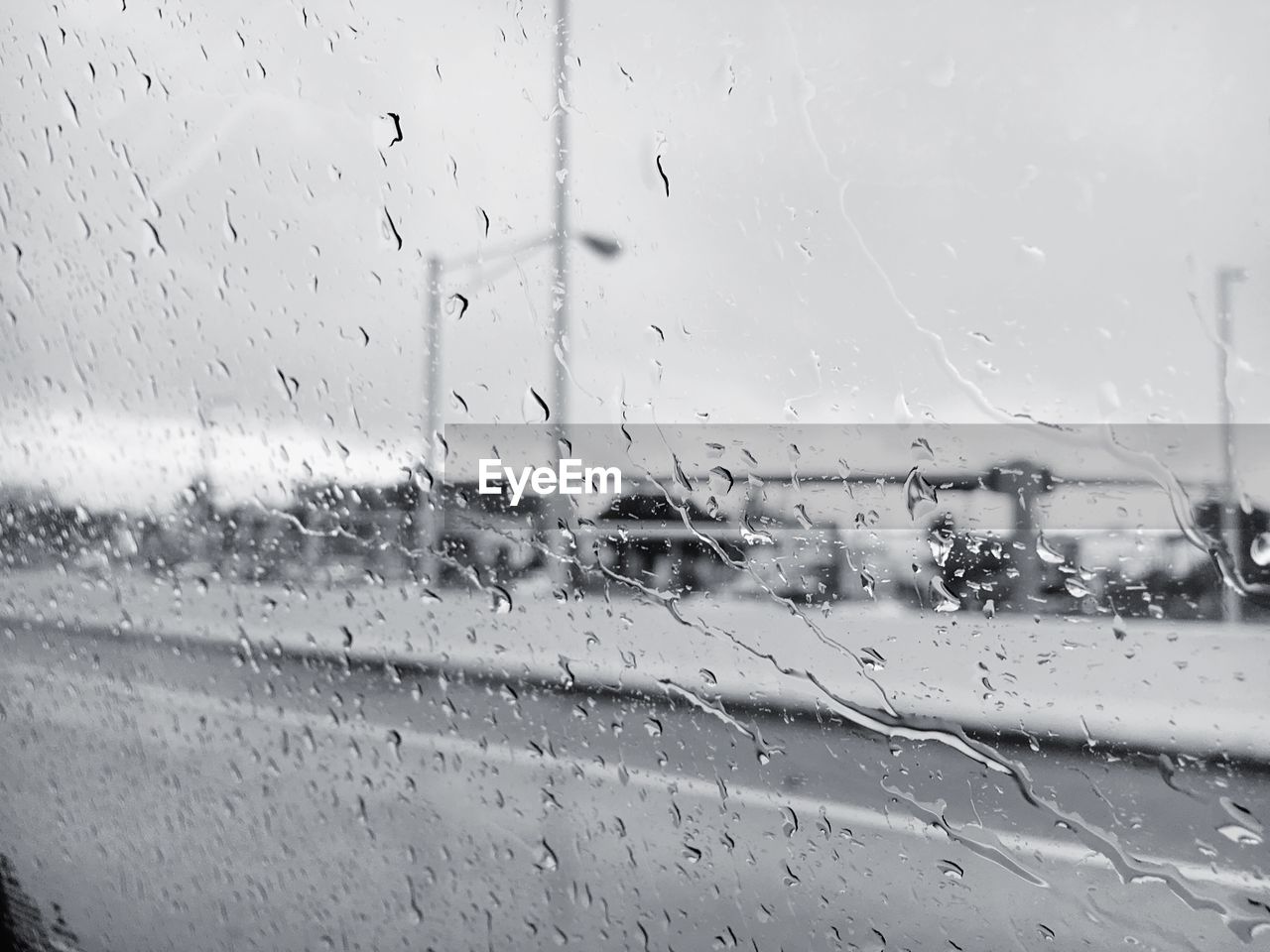 Full frame shot of wet glass window in rainy season