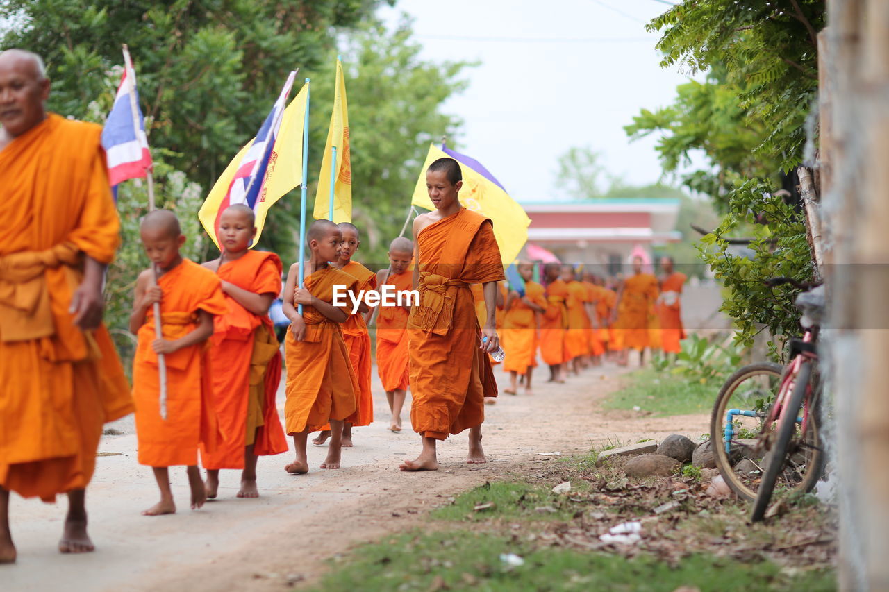 GROUP OF PEOPLE WALKING ON TEMPLE