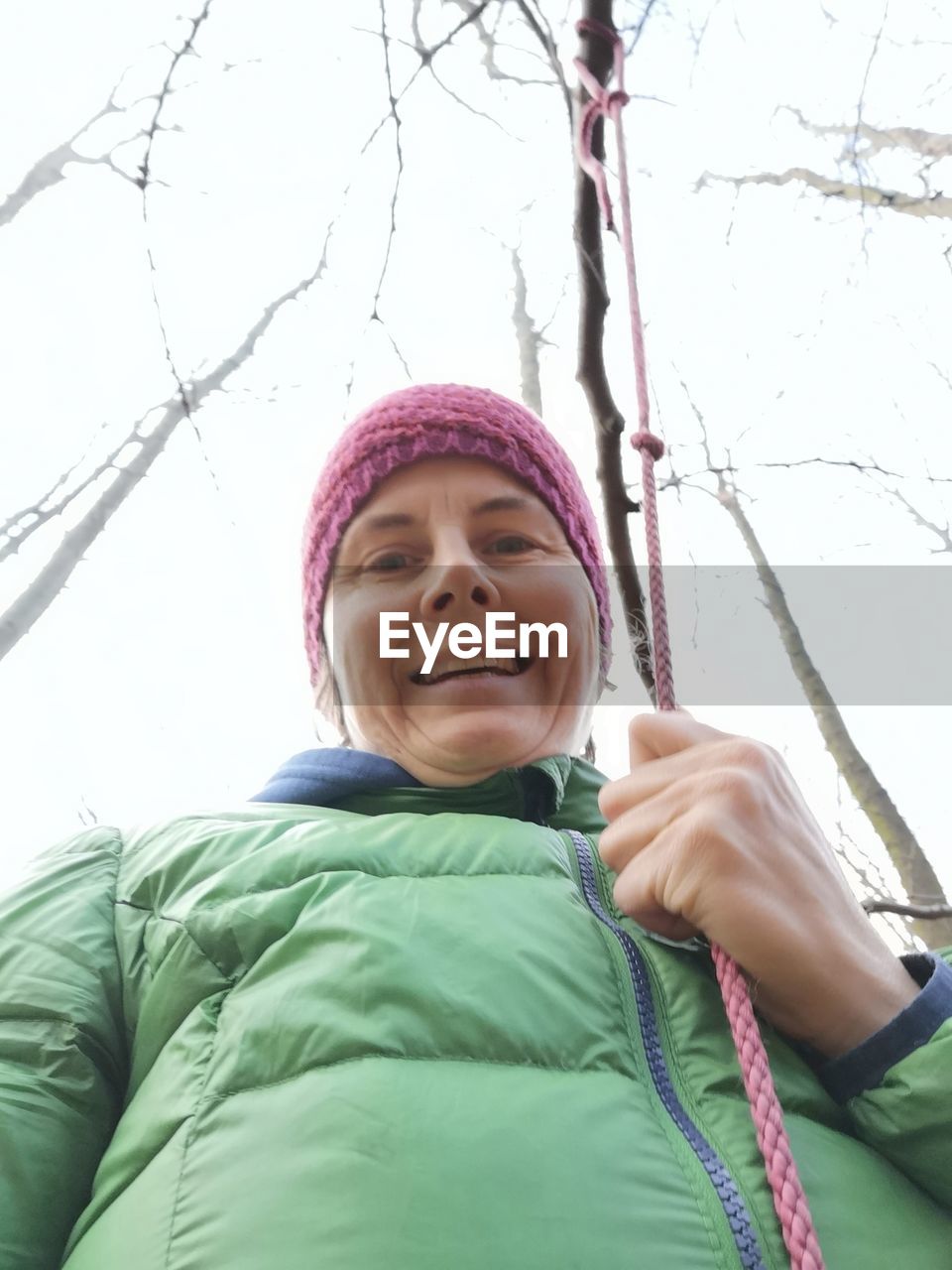 PORTRAIT OF A SMILING WOMAN IN SNOW