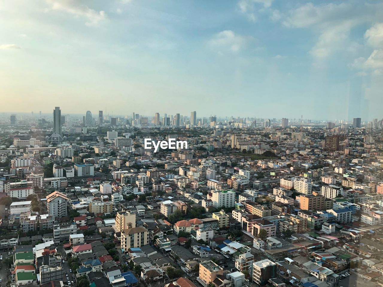 High angle view of modern buildings in city against sky