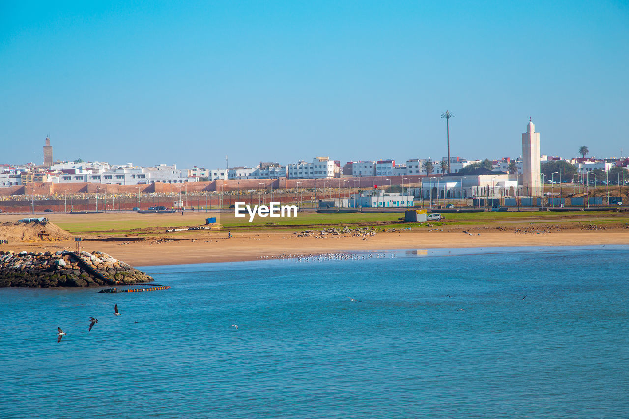 View of sea against clear blue sky