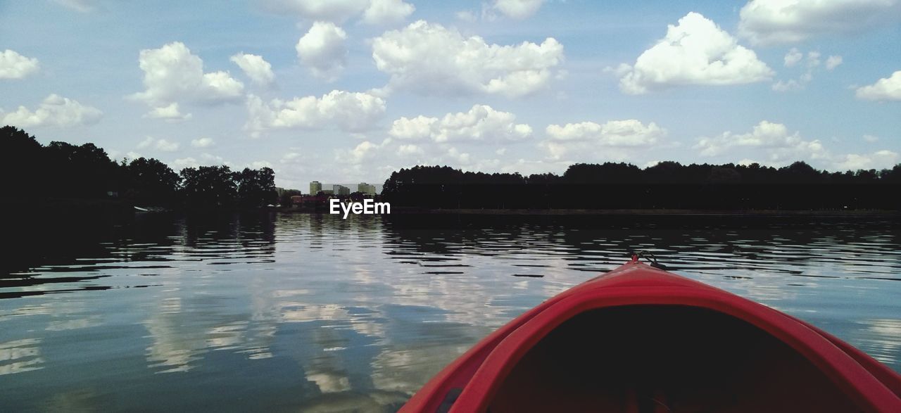 REFLECTION OF TREES ON LAKE AGAINST SKY