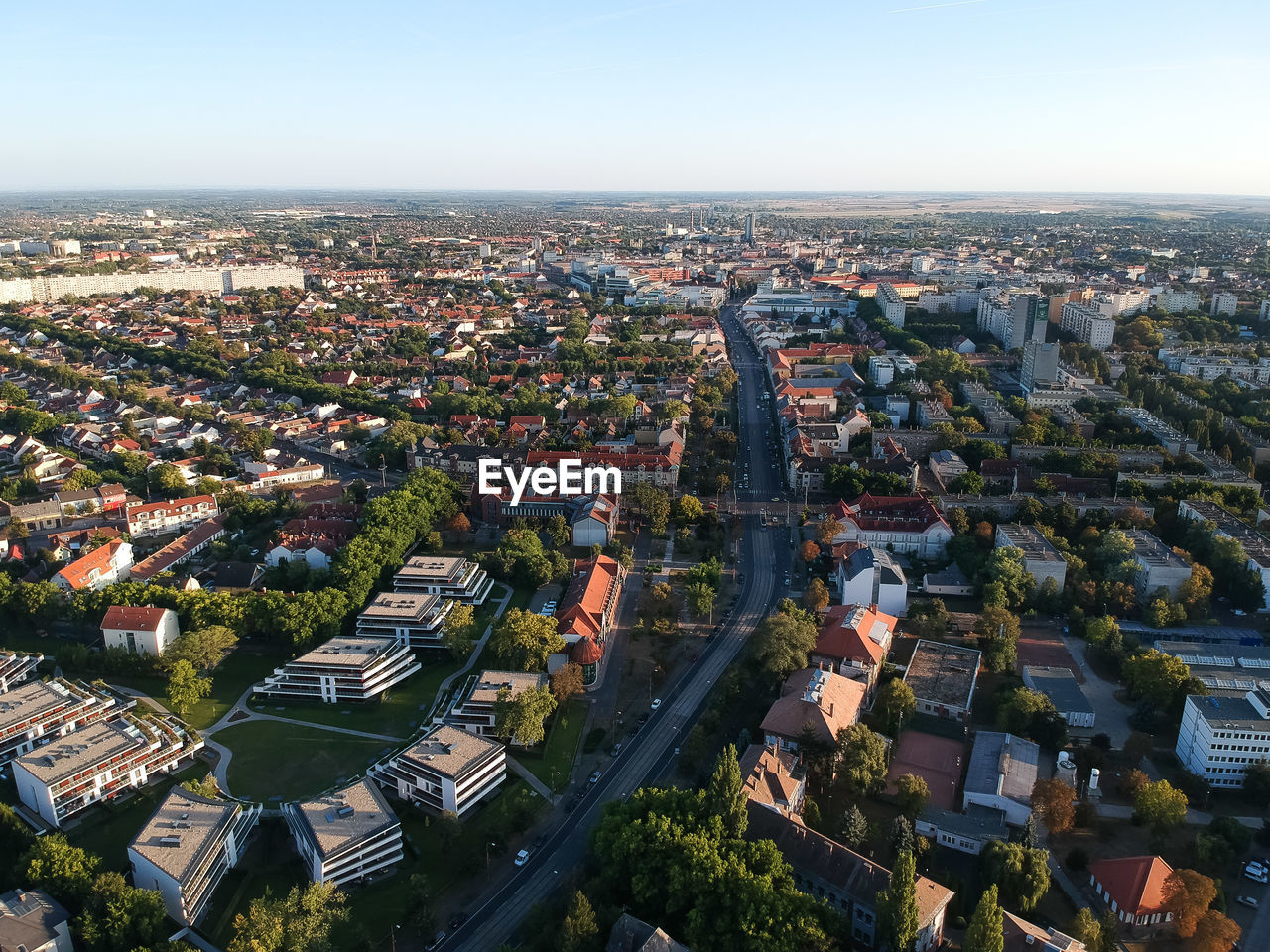 HIGH ANGLE VIEW OF ILLUMINATED CITYSCAPE AGAINST SKY