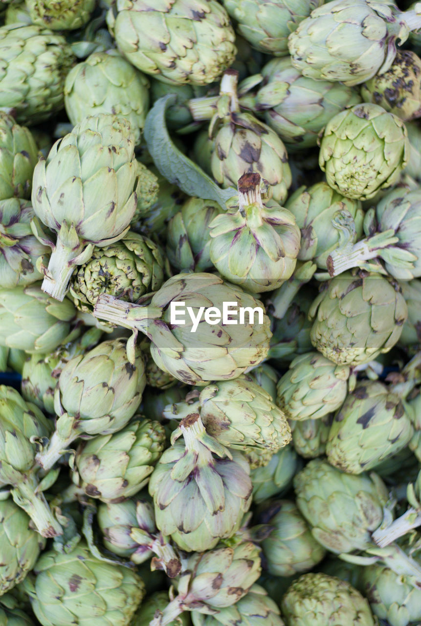 Full frame shot of artichokes at market stall