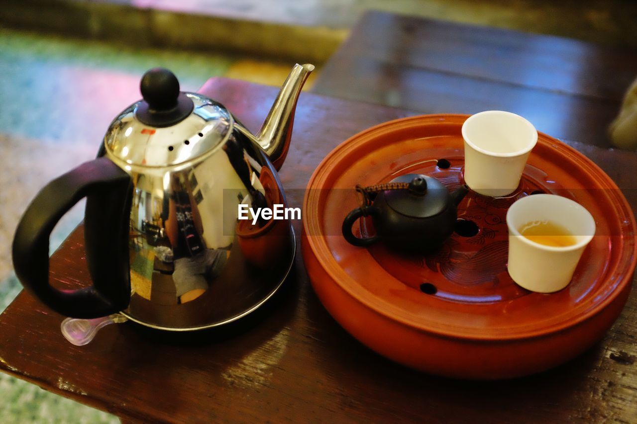 High angle view of tea served on wooden table