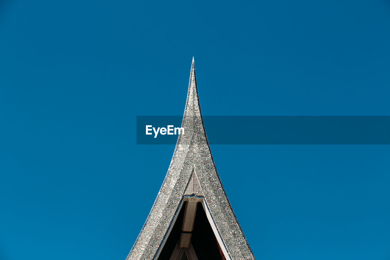 Low angle view of building against clear blue sky