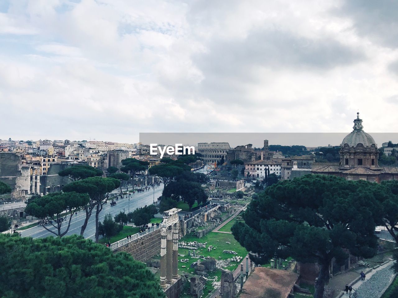 High angle view of cityscape against cloudy sky