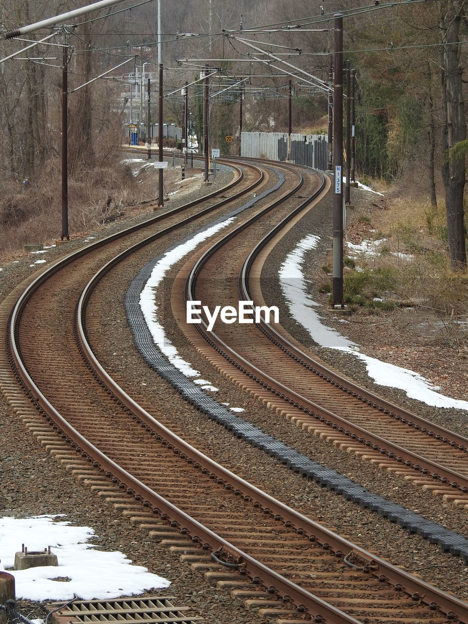 High angle view of curve railroad tracks