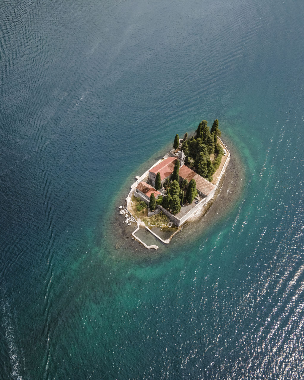 HIGH ANGLE VIEW OF SEA SHORE DURING SUNSET