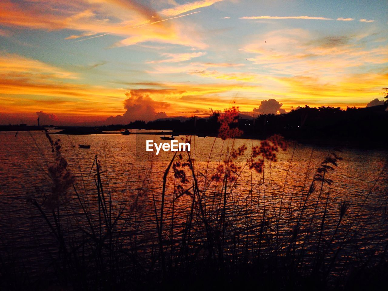 SCENIC VIEW OF LAKE DURING SUNSET