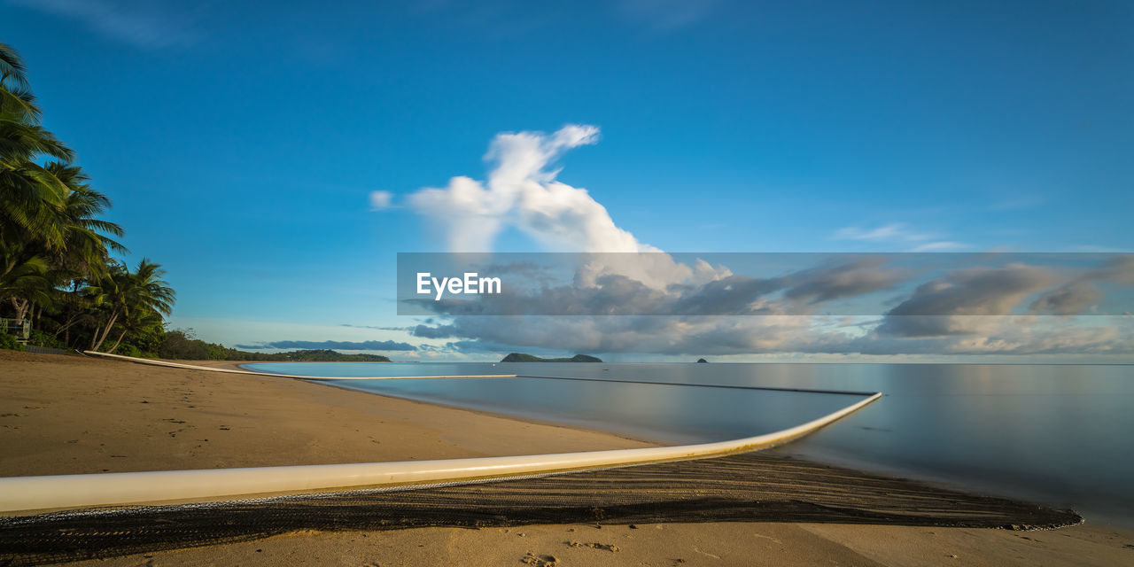 Panoramic view of sea against blue sky