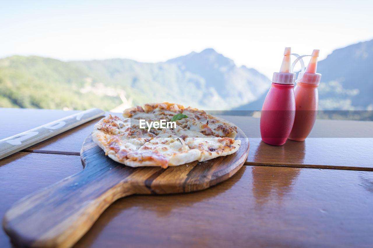 food and drink, food, pizza, fast food, dish, freshness, table, day, breakfast, dairy, wood, nature, no people, meal, drink, mountain, outdoors, healthy eating, refreshment, wellbeing, cheese