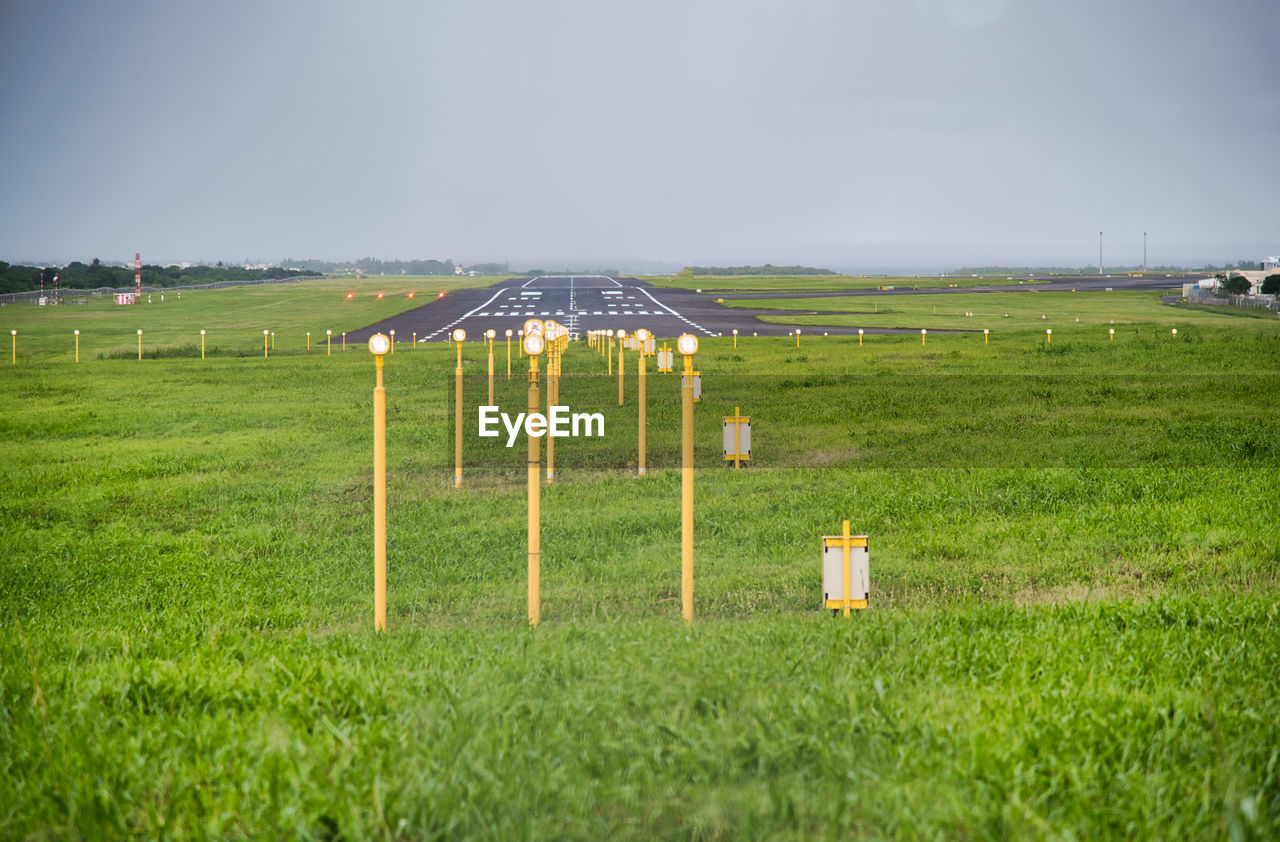 Built structure on field against sky