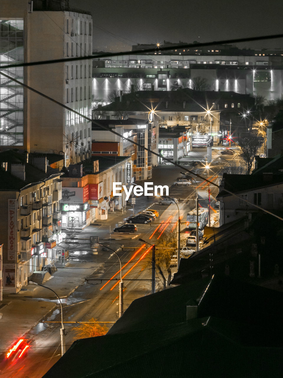 HIGH ANGLE VIEW OF ILLUMINATED CITY STREET