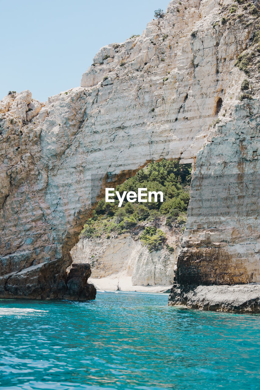Rock formation with blue ocean in zakynthos, greece.