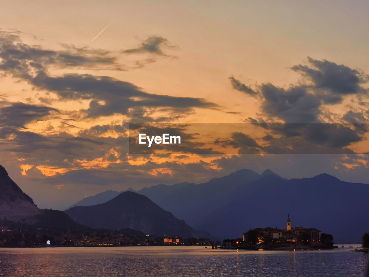mountain, sky, water, sunset, dawn, cloud, nature, scenics - nature, beauty in nature, mountain range, evening, sea, horizon, travel destinations, architecture, landscape, afterglow, environment, travel, tranquility, no people, reflection, land, city, outdoors, nautical vessel, bay, transportation, tranquil scene, night, dramatic sky, tourism, twilight, holiday, idyllic