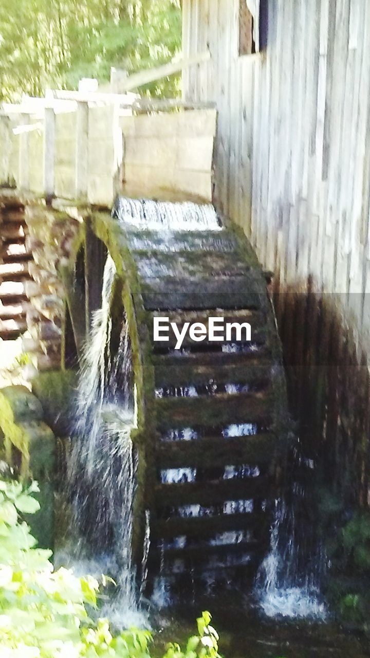 WATER FLOWING IN WATERFALL