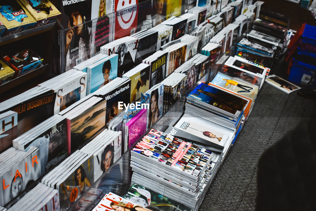 High angle view of magazines for sale