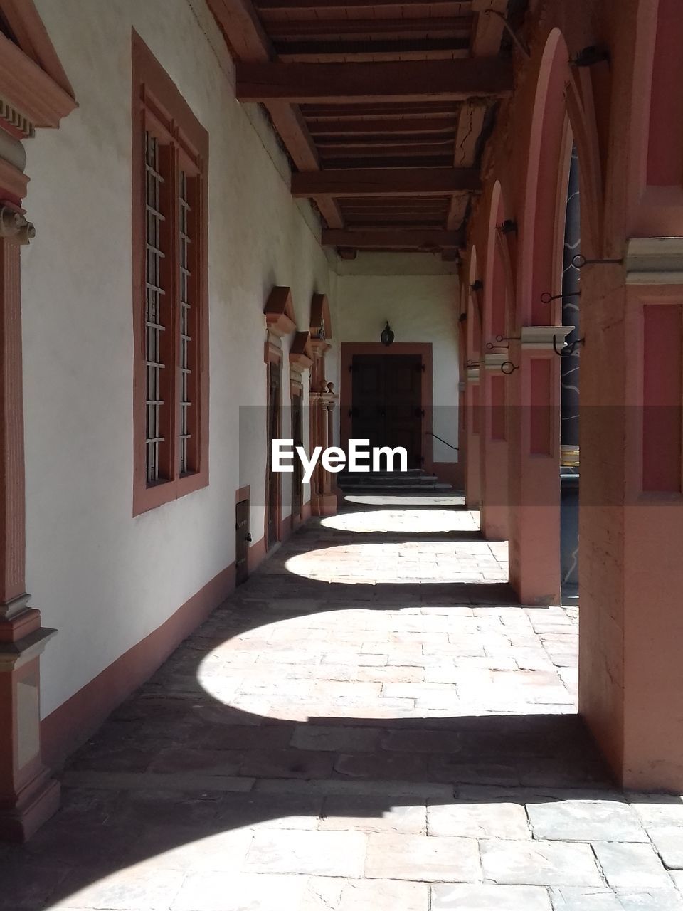 EMPTY CORRIDOR WITH BUILDING