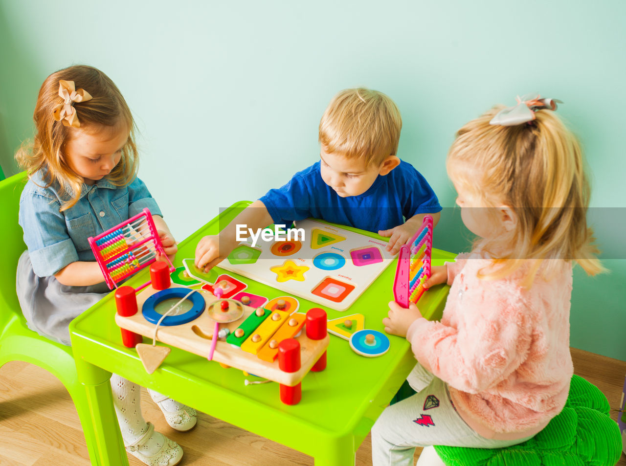 High angle view of children playing with toy