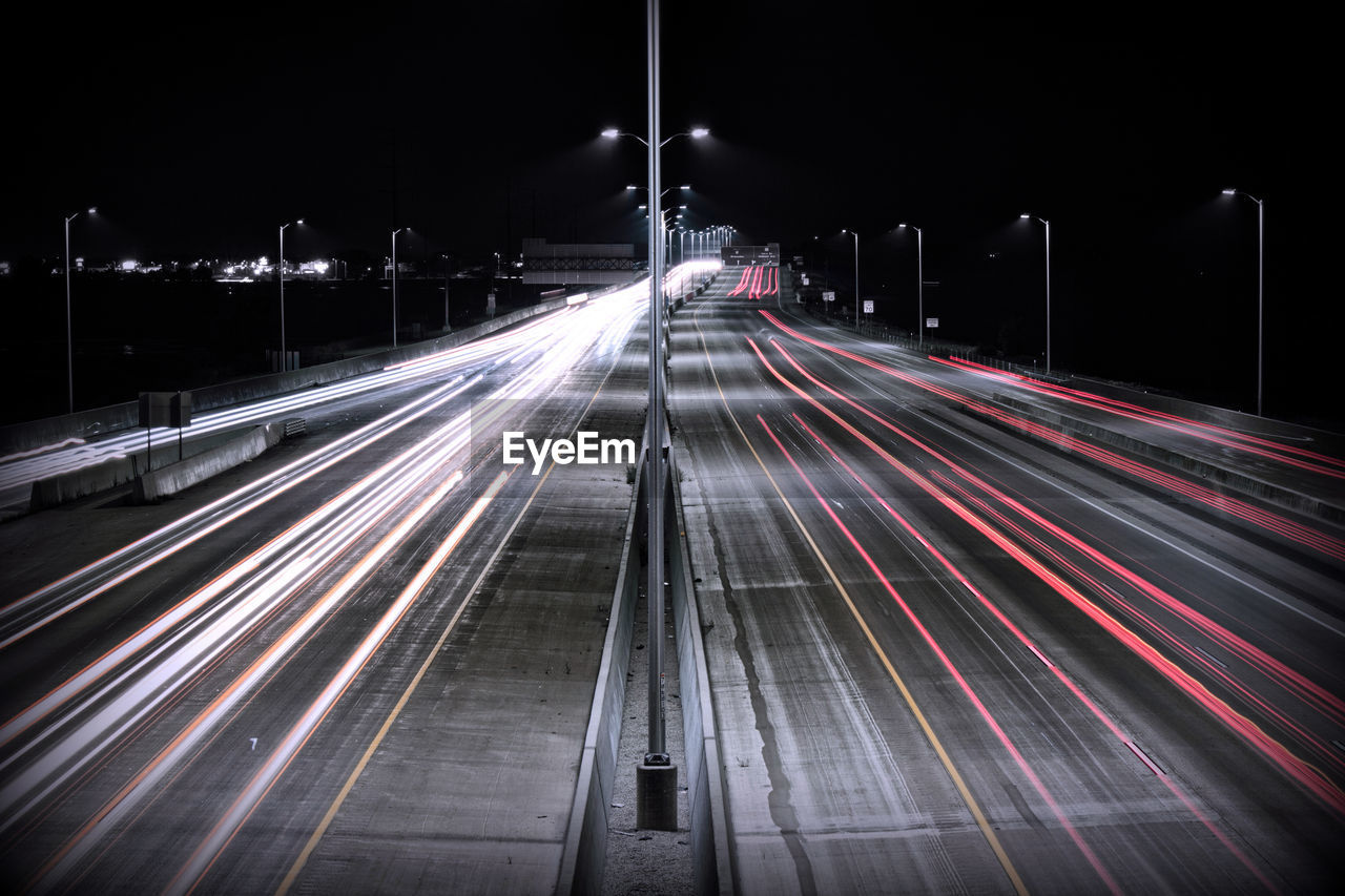 High angle view of light trails on road at night