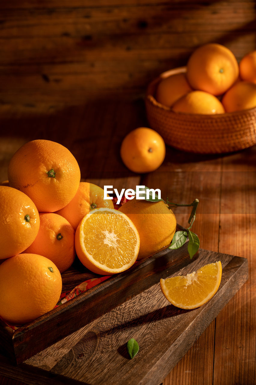 food and drink, food, healthy eating, fruit, citrus fruit, wellbeing, wood, freshness, citrus, clementine, produce, orange color, orange, blood orange, tangerine, plant, no people, lemon, yellow, rustic, grapefruit, studio shot, indoors, high angle view, still life photography, still life, container, cross section