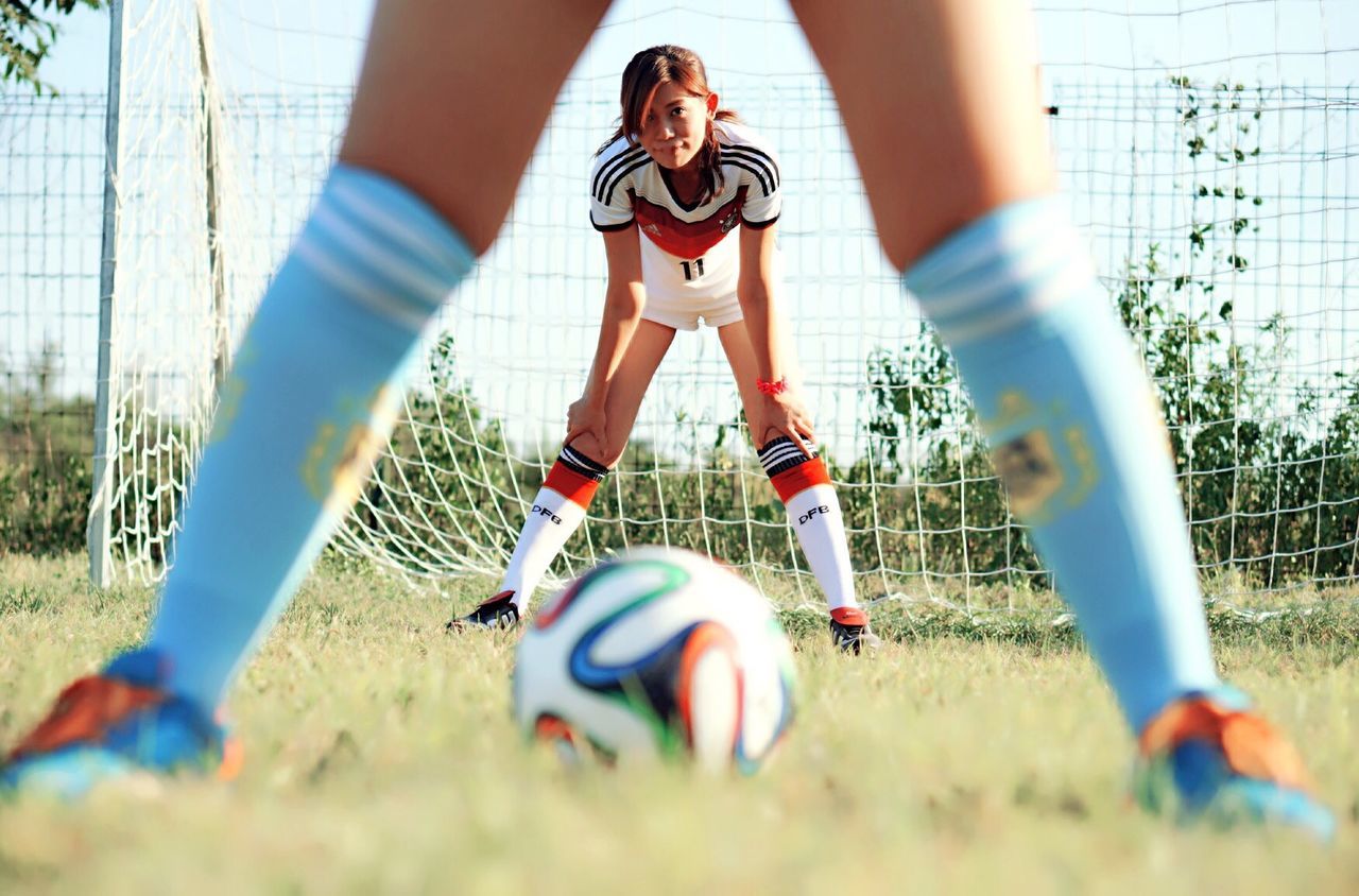 GIRL PLAYING SOCCER ON FIELD