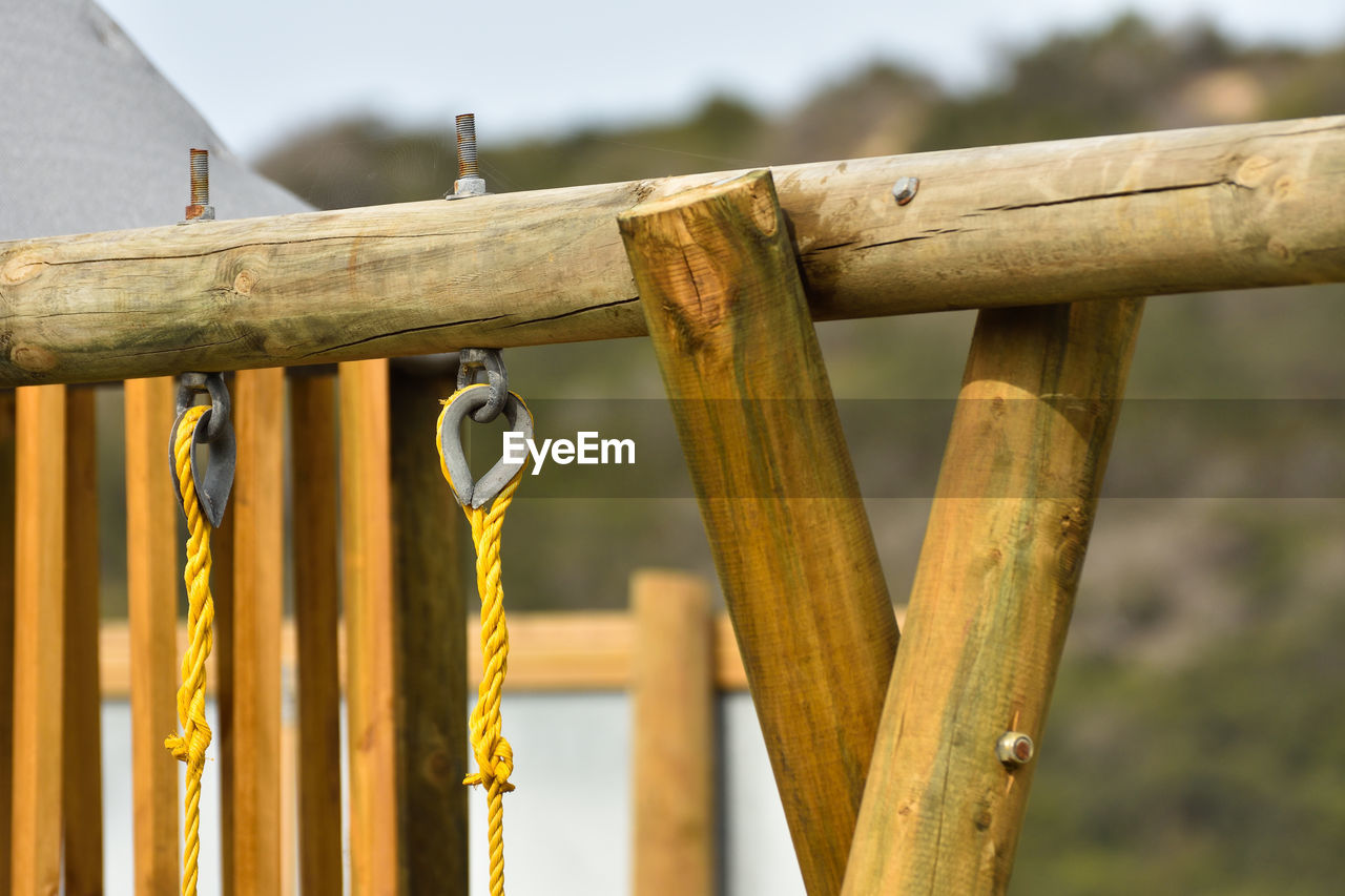Wooden swing frame structure in playground