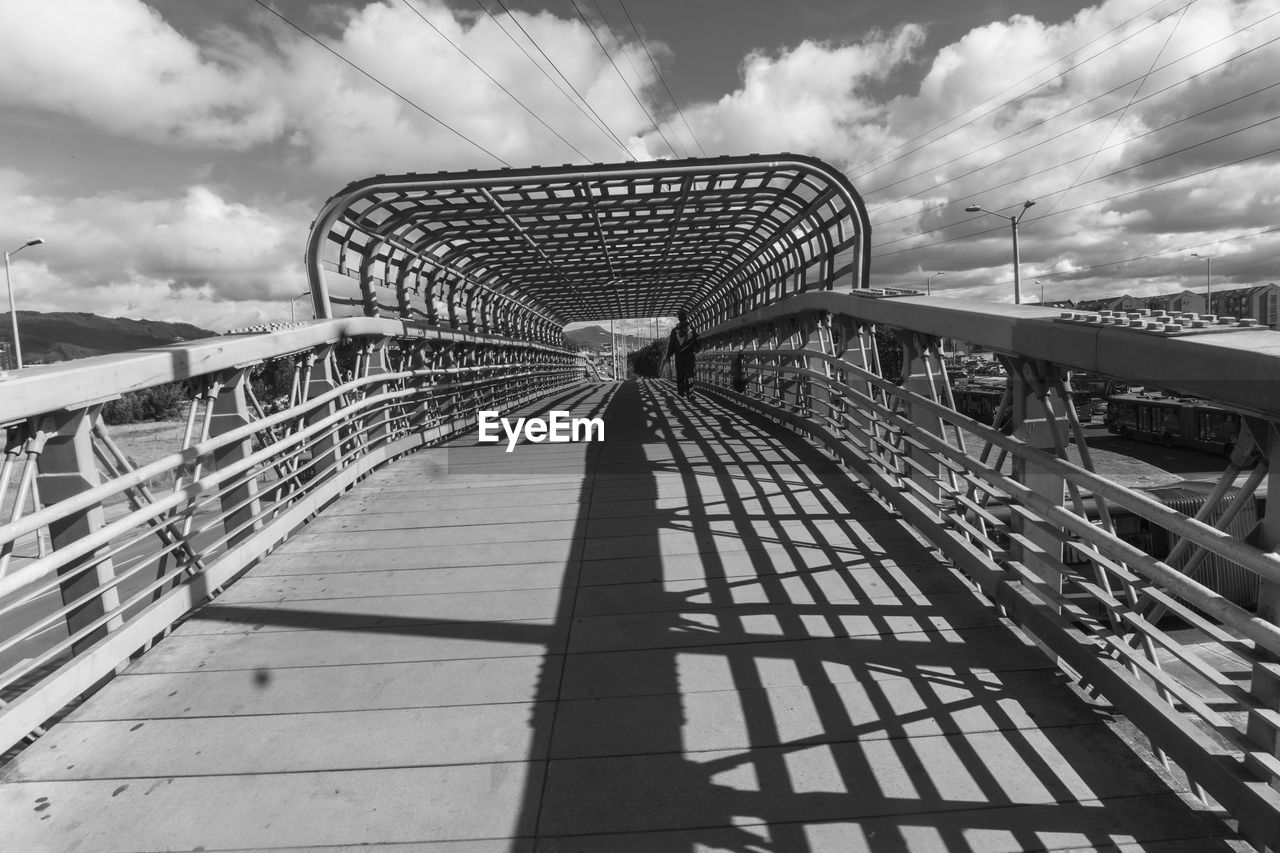 View of bridge against cloudy sky