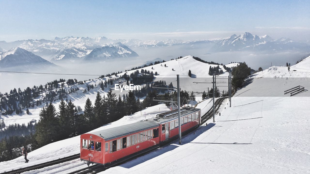 High angle view of train on snow covered mountain