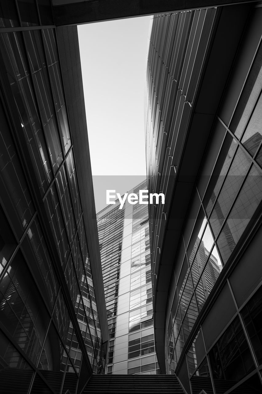 LOW ANGLE VIEW OF MODERN BUILDINGS AGAINST SKY