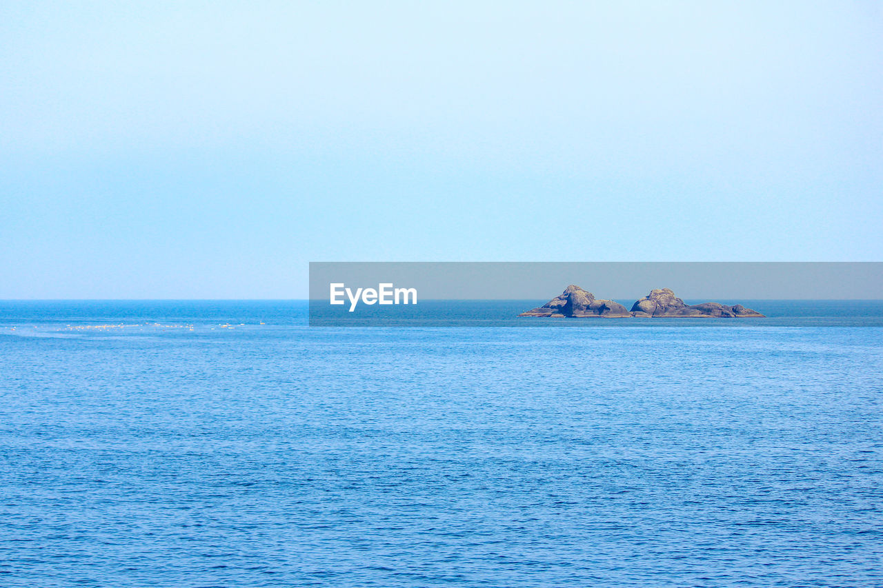 Scenic view of sea against clear sky