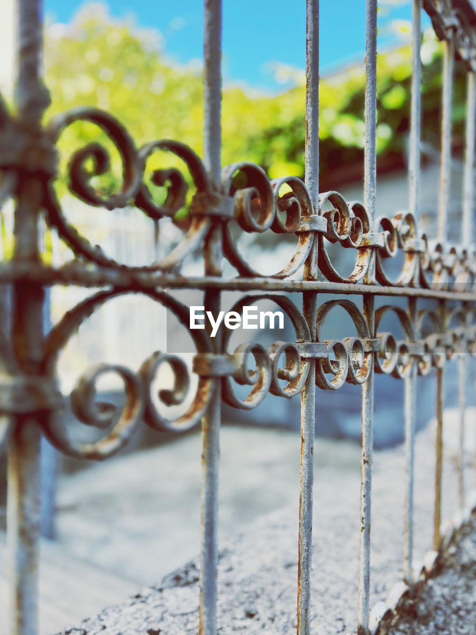 metal, iron, security, protection, gate, fence, wrought iron, no people, focus on foreground, day, architecture, close-up, rusty, outdoors, lock, railing, nature, closed, pattern, grid, metal grate, grate, wire, outdoor structure, chain, wood
